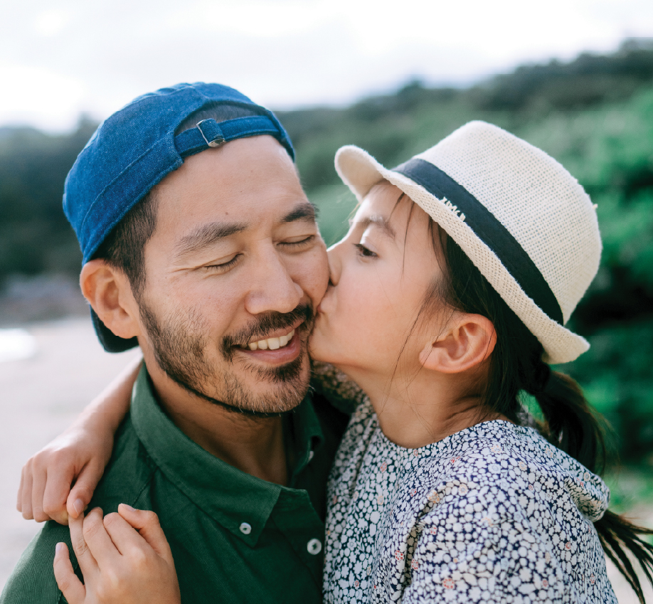 Woman kissing man on cheek