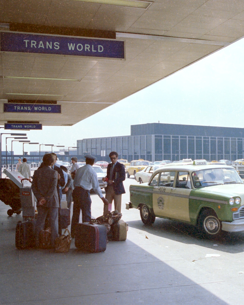 Travelers unloading luggage at airport